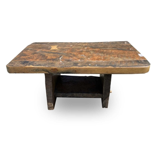 3065 - A rustic low table, made from reclaimed marine timber, raised on slab supports, height 43cm, width 8... 