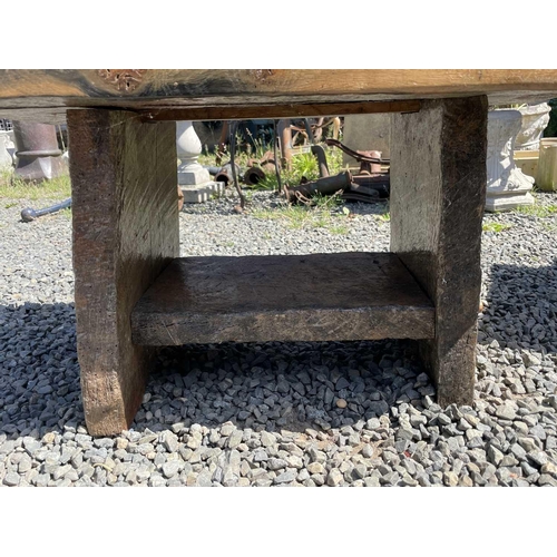 3065 - A rustic low table, made from reclaimed marine timber, raised on slab supports, height 43cm, width 8... 