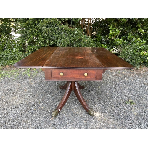 3067 - A Regency mahogany Pembroke table, fitted with a single end drawer, and raised on a turned central c... 