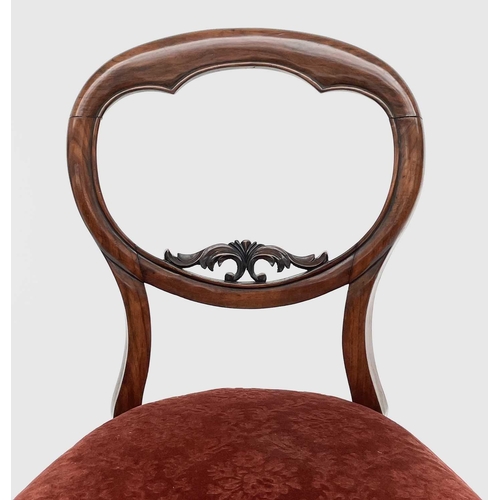 3068 - A set of six Victorian rosewood balloon back dining chairs, with moulded and carved backs, stuff ove... 