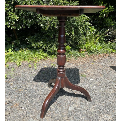 3069 - A George III mahogany pedestal occasional table, the rectangular top raised on a turned column and t... 