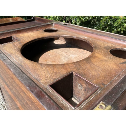 3074 - An early George III mahogany washstand, the divided folding top opening to reveal spaces for a wash ... 