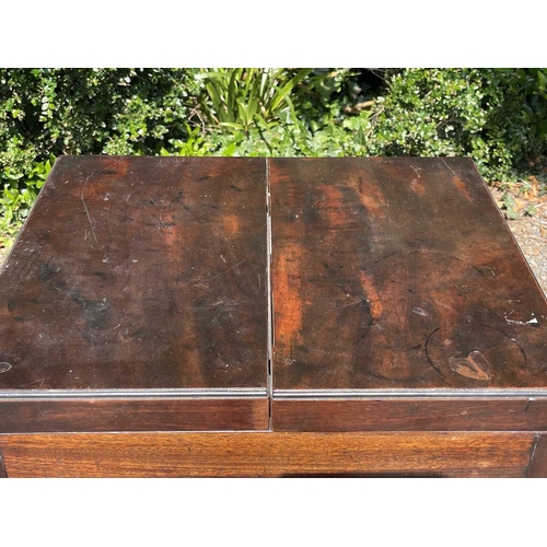 3074 - An early George III mahogany washstand, the divided folding top opening to reveal spaces for a wash ... 