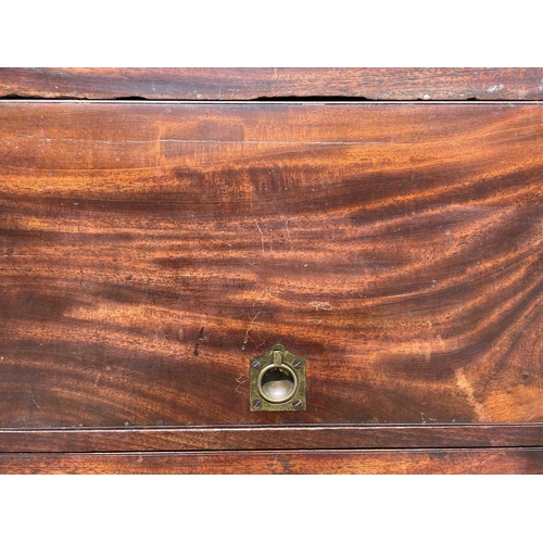 3074 - An early George III mahogany washstand, the divided folding top opening to reveal spaces for a wash ... 