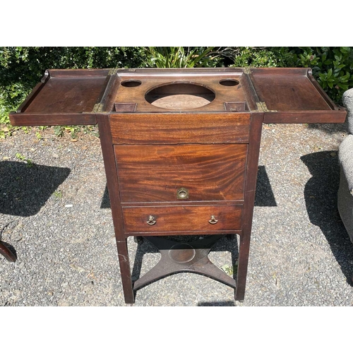 3074 - An early George III mahogany washstand, the divided folding top opening to reveal spaces for a wash ... 