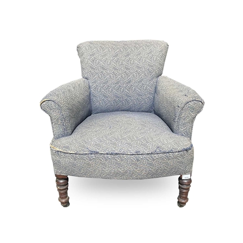 3076 - A late Victorian low armchair, raised on turned front legs and castors, height 72cm, width 73cm, dep... 