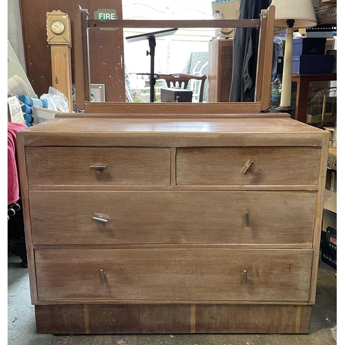 3081 - A 1930s/40s limed oak dressing table with adjustable mirror, fitted two short and two long drawers, ... 