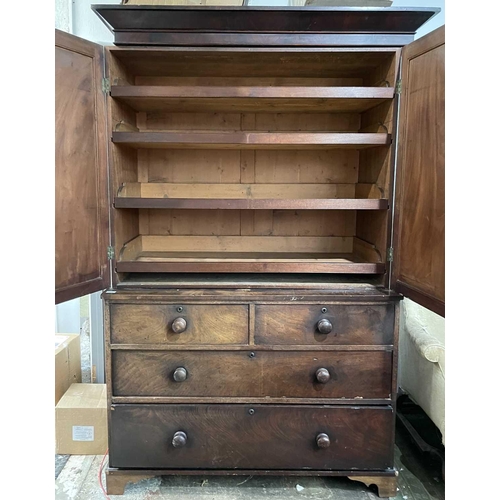 3083 - A Victorian mahogany linen press, the upper part fitted with sliding trays, with two short and two l... 