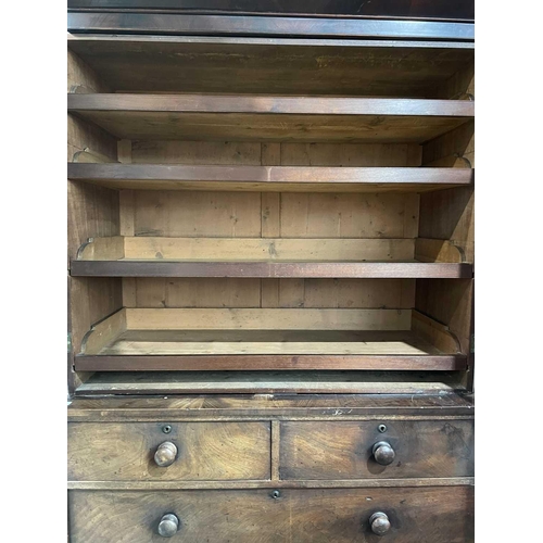 3083 - A Victorian mahogany linen press, the upper part fitted with sliding trays, with two short and two l... 