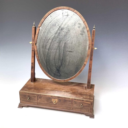 3085 - A George III coromandel oval swing toilet mirror, the base fitted with three drawers, height 59cm, w... 