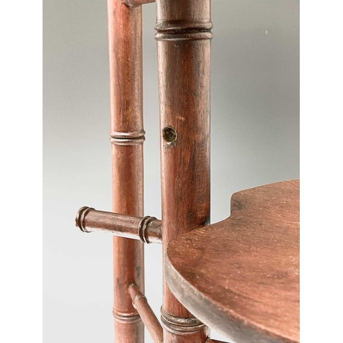 3088 - An Arts and Crafts mahogany stand, with three staggered leaf shape tiers and simulated bamboo turned... 