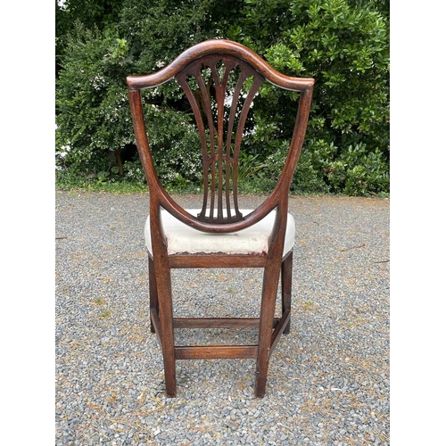 3089 - A set of ten Hepplewhite style mahogany dining chairs, circa 1900, the shield shape backs with pierc... 