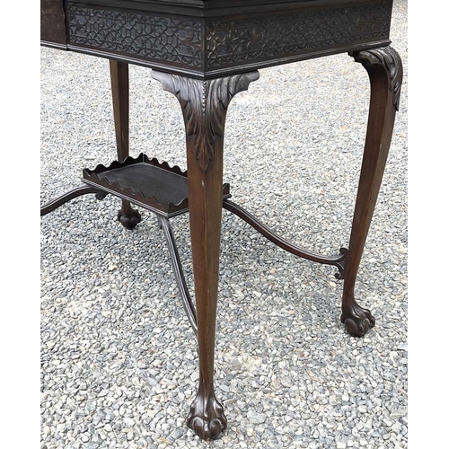 3090 - An Edwardian mahogany centre table, with blind fret carved frieze, on cabriole legs with an undertie... 