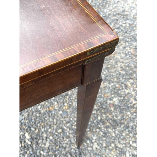 3091 - A late George III mahogany and crossbanded fold top card table, raised on square taper legs, height ... 