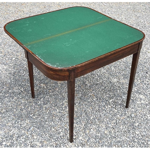 3091 - A late George III mahogany and crossbanded fold top card table, raised on square taper legs, height ... 