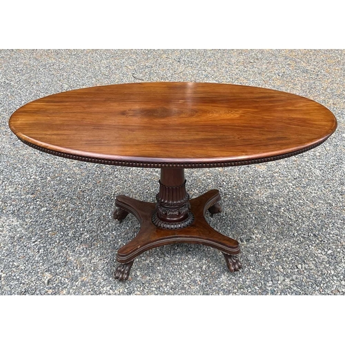 3092 - An early Victorian mahogany oval supper table, the top with beaded edge and raised on a turned and l... 