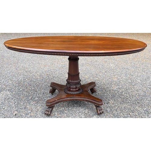 3092 - An early Victorian mahogany oval supper table, the top with beaded edge and raised on a turned and l... 