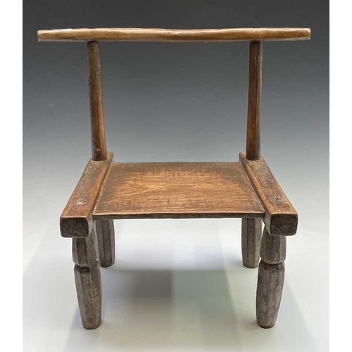 3095 - A late 19th/ early 20th century primitive chair, Ivory Coast, Dan Tribe, height 55cm.