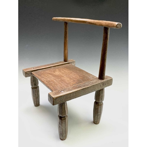 3095 - A late 19th/ early 20th century primitive chair, Ivory Coast, Dan Tribe, height 55cm.