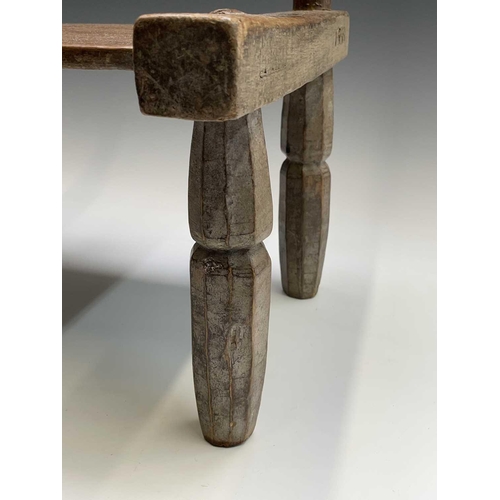 3095 - A late 19th/ early 20th century primitive chair, Ivory Coast, Dan Tribe, height 55cm.