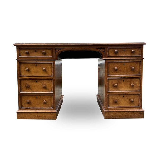 3097 - A Victorian oak desk, stamped Taylor, Fisher & Blunt, 110 Fenchurch St, London, with eight pedestal ... 