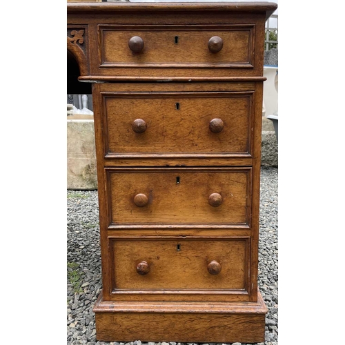 3097 - A Victorian oak desk, stamped Taylor, Fisher & Blunt, 110 Fenchurch St, London, with eight pedestal ... 