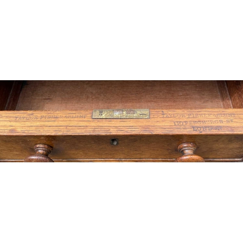 3097 - A Victorian oak desk, stamped Taylor, Fisher & Blunt, 110 Fenchurch St, London, with eight pedestal ... 