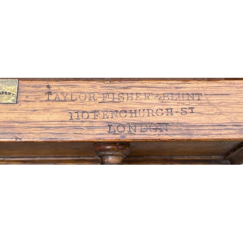 3097 - A Victorian oak desk, stamped Taylor, Fisher & Blunt, 110 Fenchurch St, London, with eight pedestal ... 