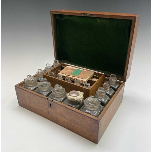 31 - A Victorian oak cased family medicine chest, fitted with an assortment of glass jars and stoppers, l... 