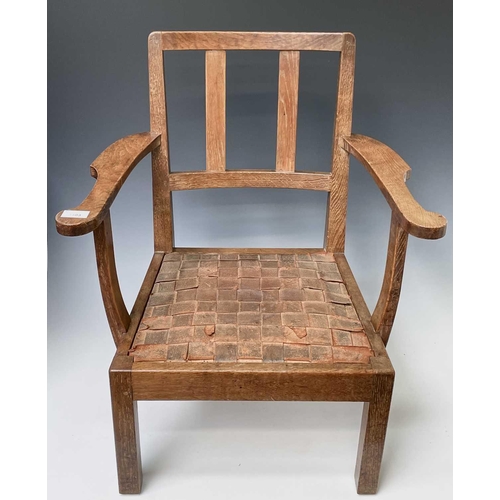 3103 - Robin Nance, An Arts and Crafts oak low open armchair, with slatted leather drop-in seat on square f... 