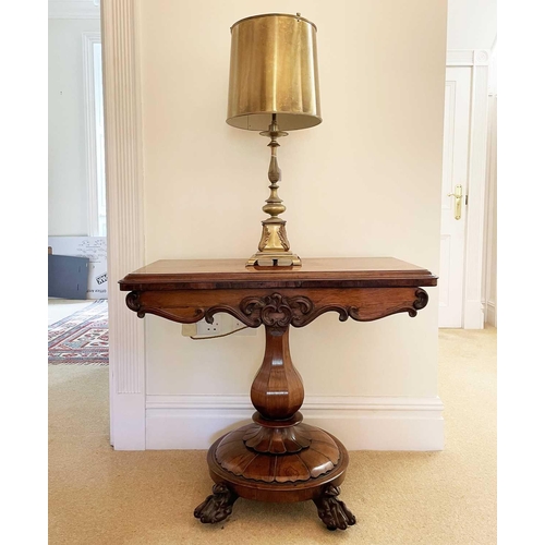 3105 - A William IV rosewood fold top tea table, raised on an octagonal baluster pillar and carved circular... 