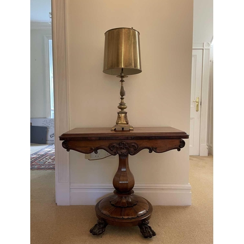 3105 - A William IV rosewood fold top tea table, raised on an octagonal baluster pillar and carved circular... 