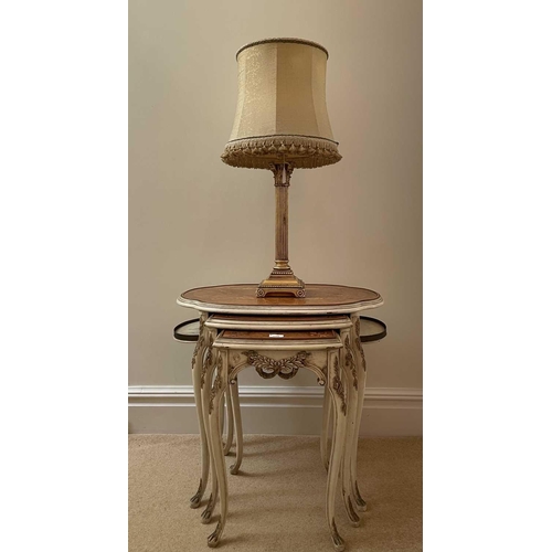 3106 - A nest of three French walnut, kingwood and marquetry occasional tables, circa 1920, the largest wit... 