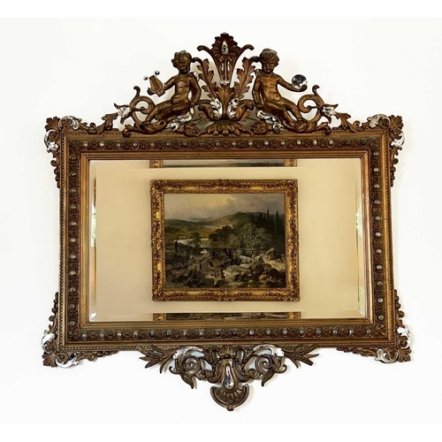 3107 - A French ornate gilt-gesso wall mirror, late 19th century, surmounted by two cherubs playing musical... 