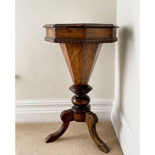 3108 - A Victorian walnut and inlaid octagonal work table, with fitted interior and raised on a carved trip... 