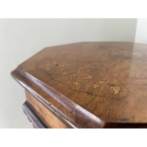 3108 - A Victorian walnut and inlaid octagonal work table, with fitted interior and raised on a carved trip... 