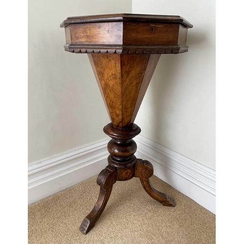 3108 - A Victorian walnut and inlaid octagonal work table, with fitted interior and raised on a carved trip... 