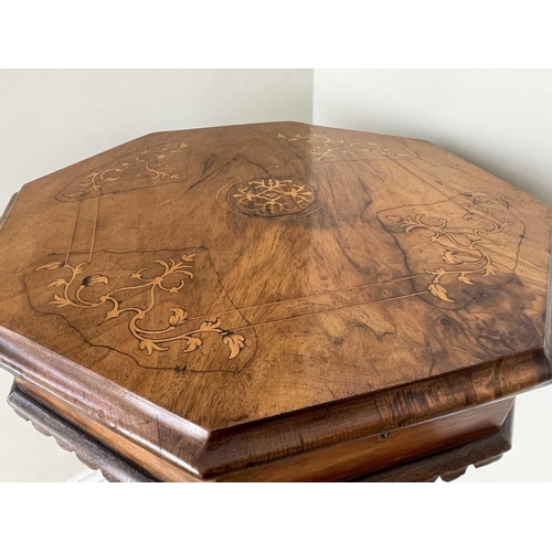 3108 - A Victorian walnut and inlaid octagonal work table, with fitted interior and raised on a carved trip... 