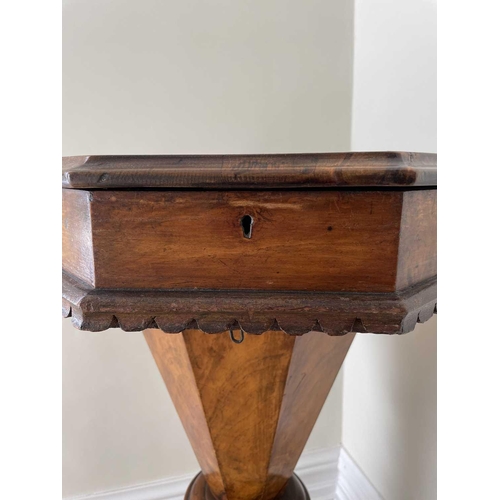 3108 - A Victorian walnut and inlaid octagonal work table, with fitted interior and raised on a carved trip... 