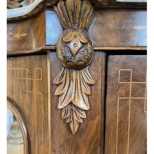 3109 - A Victorian walnut chiffonier with shaped carved frame mirror back above a white marbled top and fit... 