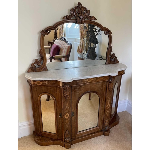 3109 - A Victorian walnut chiffonier with shaped carved frame mirror back above a white marbled top and fit... 