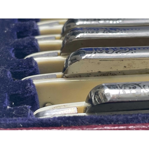 311 - A cased set of seven cut throat razors, each engraved with the days of the week, the red leather cas... 