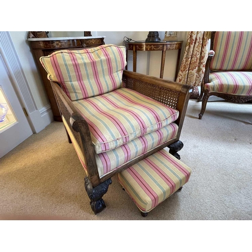 3113 - A pair of beech and walnut framed Bergere armchairs, circa 1920, with caned backs and arms, on carve... 