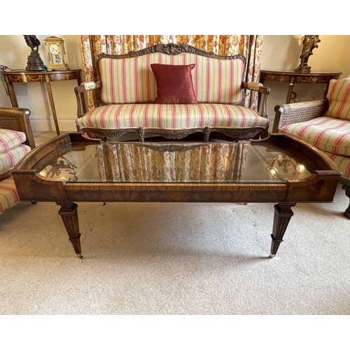 3114 - A mahogany and crossbanded coffee table, 20th century, with inset leather skiver, raised on squared ... 