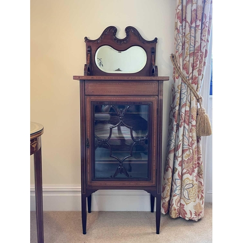 3115 - An Edwardian mahogany and satinwood banded music cabinet, with raised mirrored back above a glazed d... 