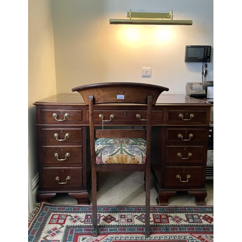 3117 - An Edwardian mahogany twin pedestal writing desk, with tooled leather skiver, and fitted with an arr... 