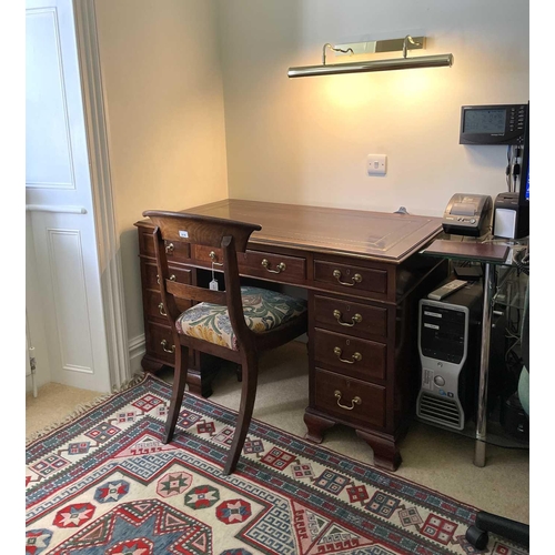 3117 - An Edwardian mahogany twin pedestal writing desk, with tooled leather skiver, and fitted with an arr... 