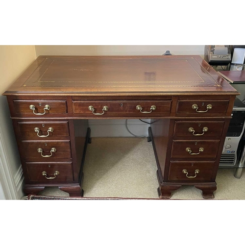 3117 - An Edwardian mahogany twin pedestal writing desk, with tooled leather skiver, and fitted with an arr... 