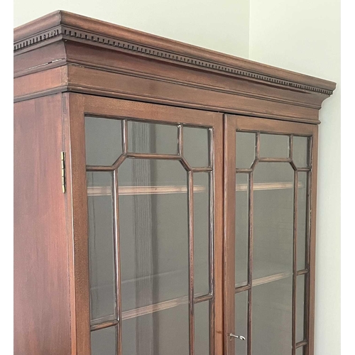 3119 - A mahogany bookcase cabinet, the upper part with glazed door enclosing three adjustable shelves, the... 