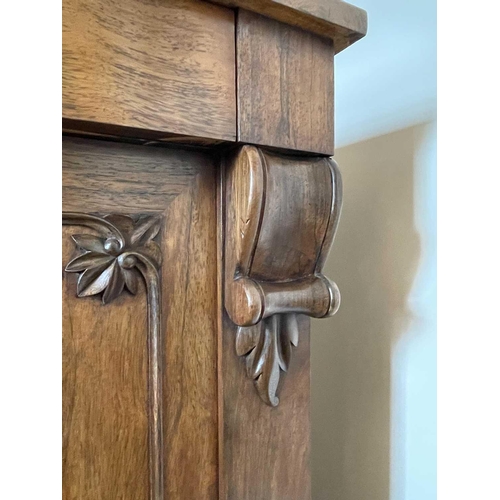 3122 - A Victorian rosewood chiffonier with raised back and fitted a long drawer and two doors on a plinth ... 